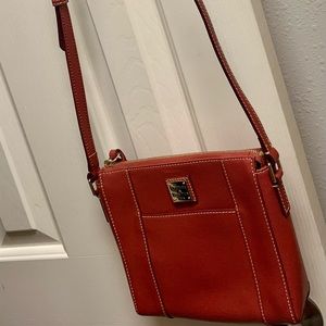 Dooney & Bourke Crossbody. Brick Reddish color. Used once.